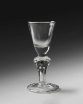 A rare Royal commemorative moulded stem glass, c.1714, the round funnel bowl with a solid base,