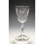 A large glass goblet, c.1760, the round funnel bowl engraved with a butterfly and a large bunch of