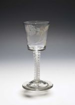 A Jacobite wine glass, c.1760, the generous bucket bowl engraved with a rose and bud spray, the