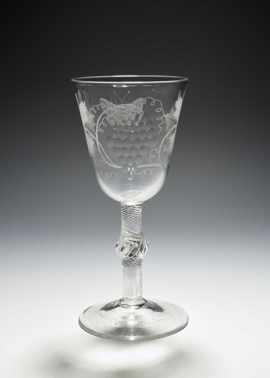 A large glass goblet, c.1760, the round funnel bowl engraved with a butterfly and a large bunch of - Image 2 of 2