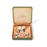 A cased set of a Royal Crown Derby flower brooch and ear clips, 1st half 20th century, each modelled