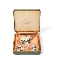 A cased set of a Royal Crown Derby flower brooch and ear clips, 1st half 20th century, each modelled