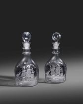 A pair of decanters and stoppers of shipping interest, late 18th/early 19th century, each engraved