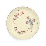 A rare Bow saucer dish or stand, c.1758, decorated in a combination of Kakiemon and famille rose