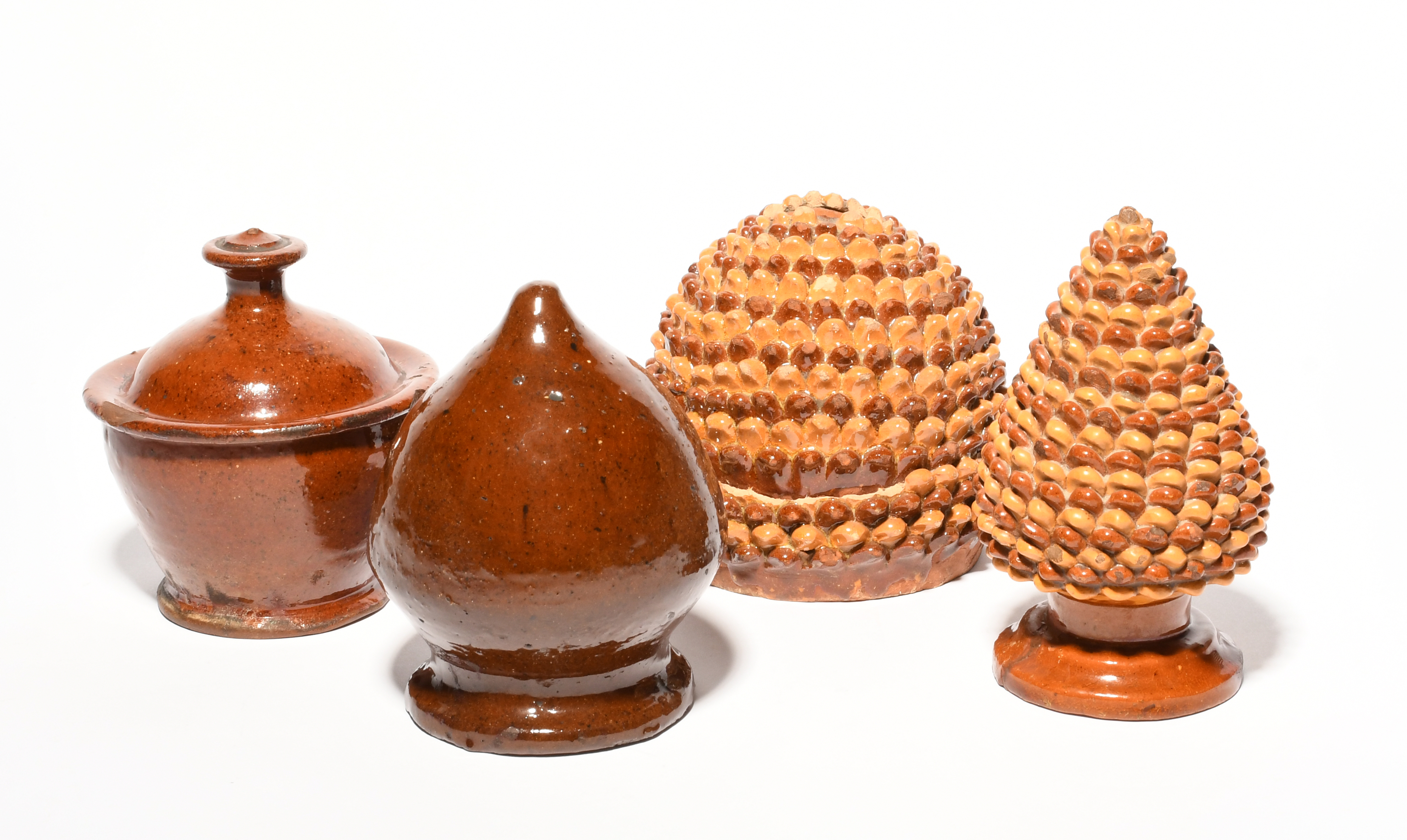 Four small Sussex slipware money boxes, 19th century, two modelled as pinecones with alternating - Image 2 of 2