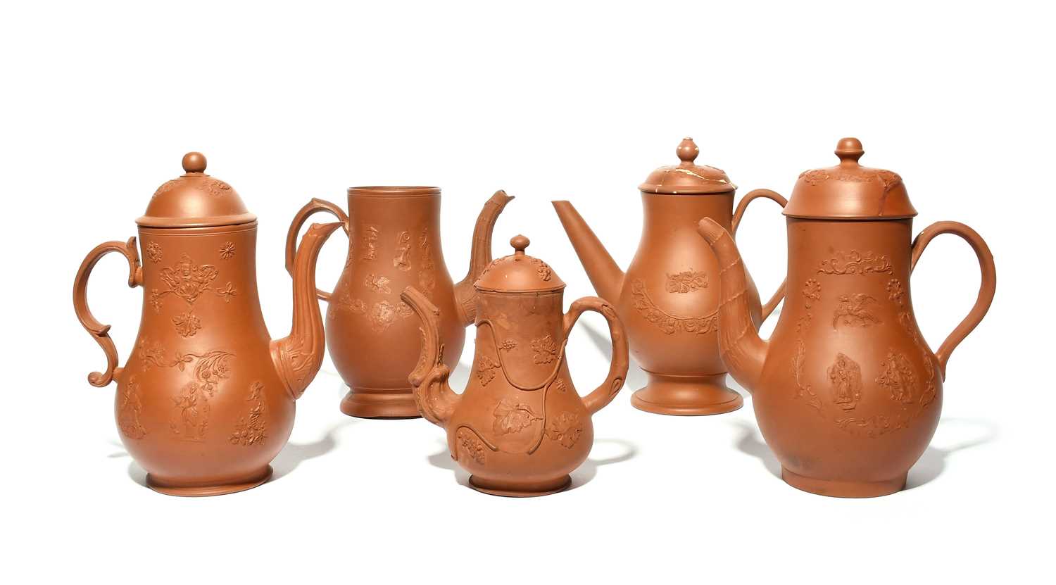 Five English redware coffee pots, c.1760-70, four with covers, of baluster form, the smallest