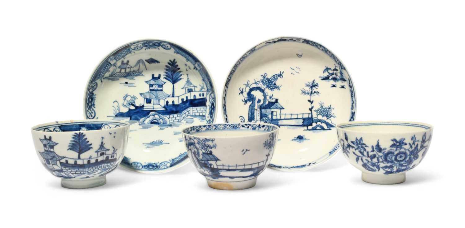 Two Lowestoft blue and white teabowls and saucers, c.1765-75, painted with Chinese pagodas in island