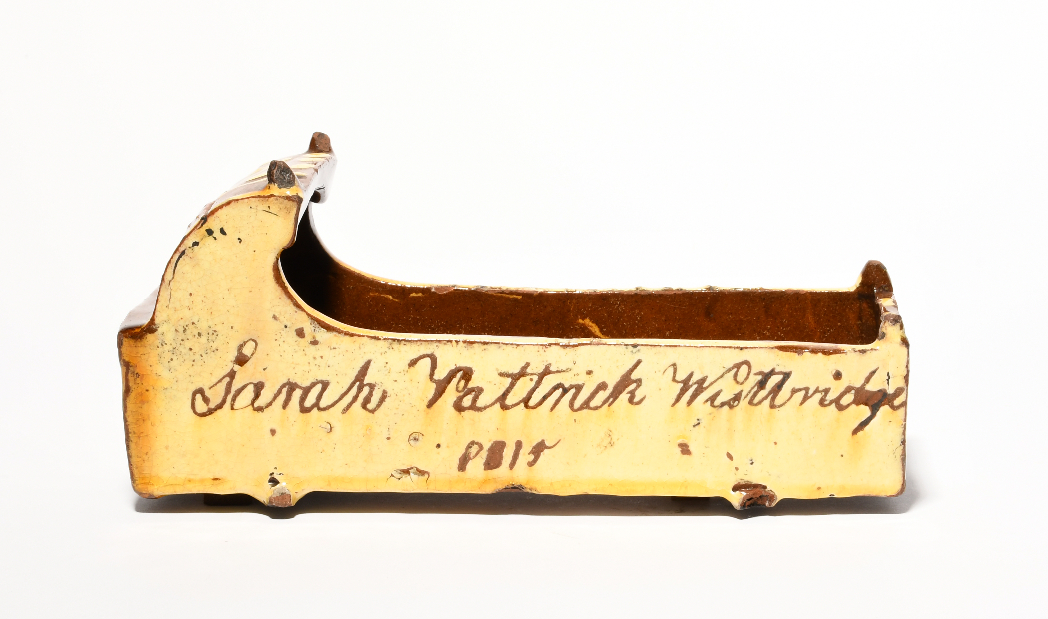 A slipware model of a cradle, dated 1815, one side incised 'Sarah Pattrick Westbridge 1815' on a - Image 3 of 3