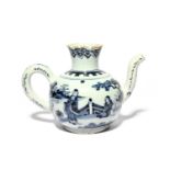 A Delft feeder or wine ewer, c.1680, the globular body painted in blue with a figure seated and