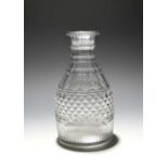 A cut glass magnum carafe, c.1790-1800, with a band of hobnail cutting beneath polished lappets