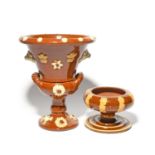 A Yorkshire slipware plant pot and stand, 19th century, the flared top applied with Prince of