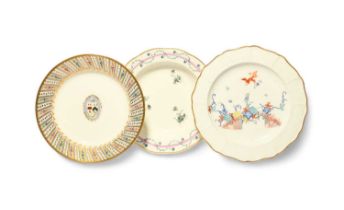 Three Derby plates or dishes, c.1780-1800, one with an armorial shield to the well, the rim with a