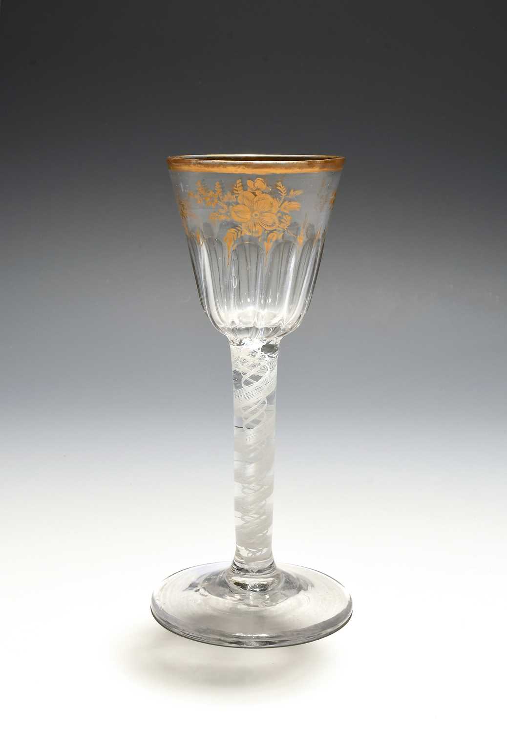 A small Giles-decorated wine glass, c.1765, the rounded funnel bowl moulded with vertical flutes,