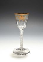 A small Giles-decorated wine glass, c.1765, the rounded funnel bowl moulded with vertical flutes,