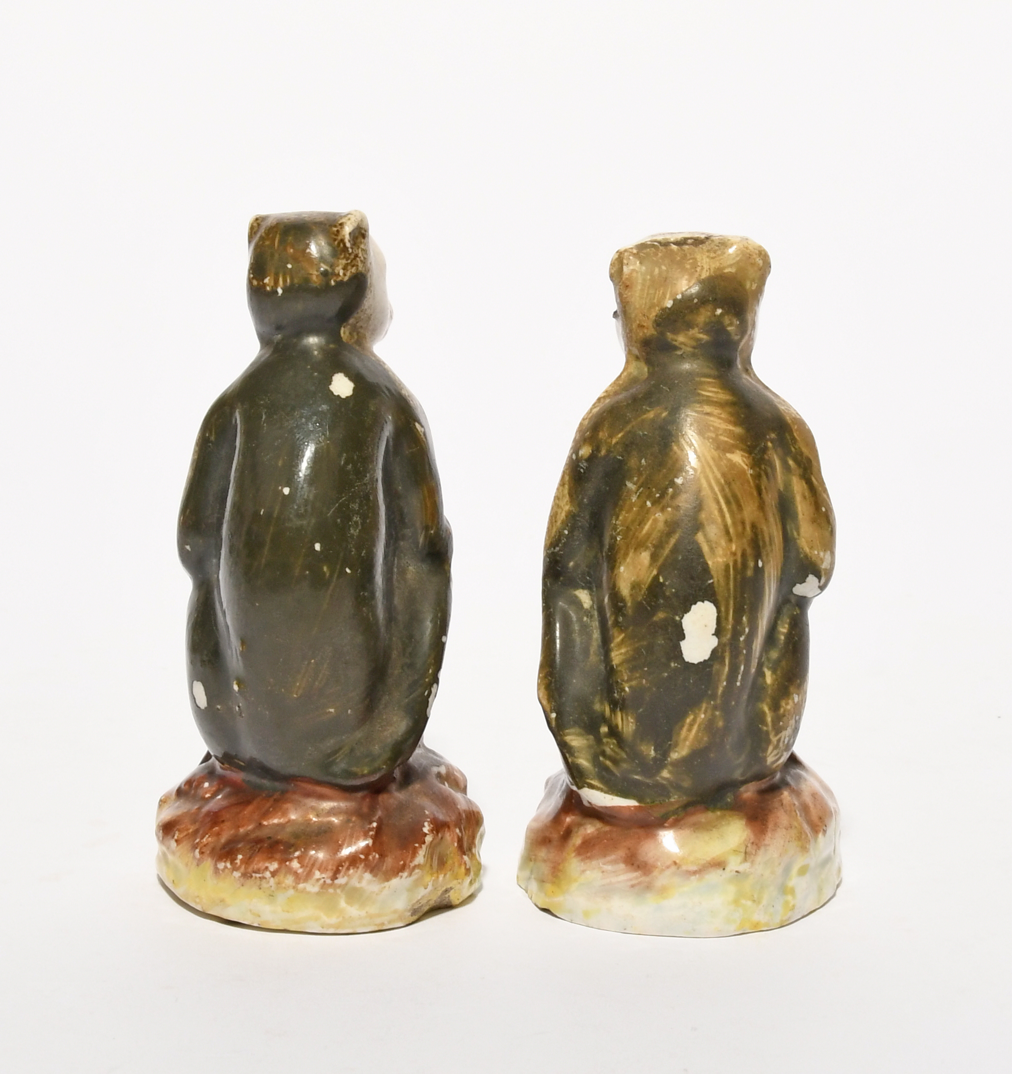 A pair of Staffordshire pearlware figures of monkeys, 19th century, each seated on a low rocky - Image 4 of 4