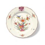 A Meissen armorial plate, 19th century, the well painted in the Kakiemon manner with an exotic