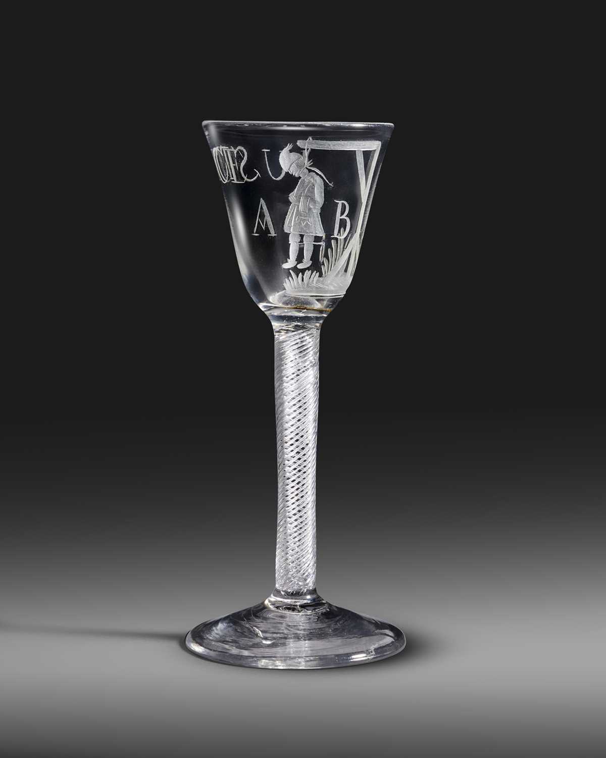 An Admiral Byng wine glass, c.1763, the round funnel bowl engraved with the officer hanging from a
