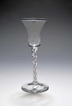 A mixed twist wine glass, c.1760, the slender flared bucket bowl raised on a mixed twist stem with a