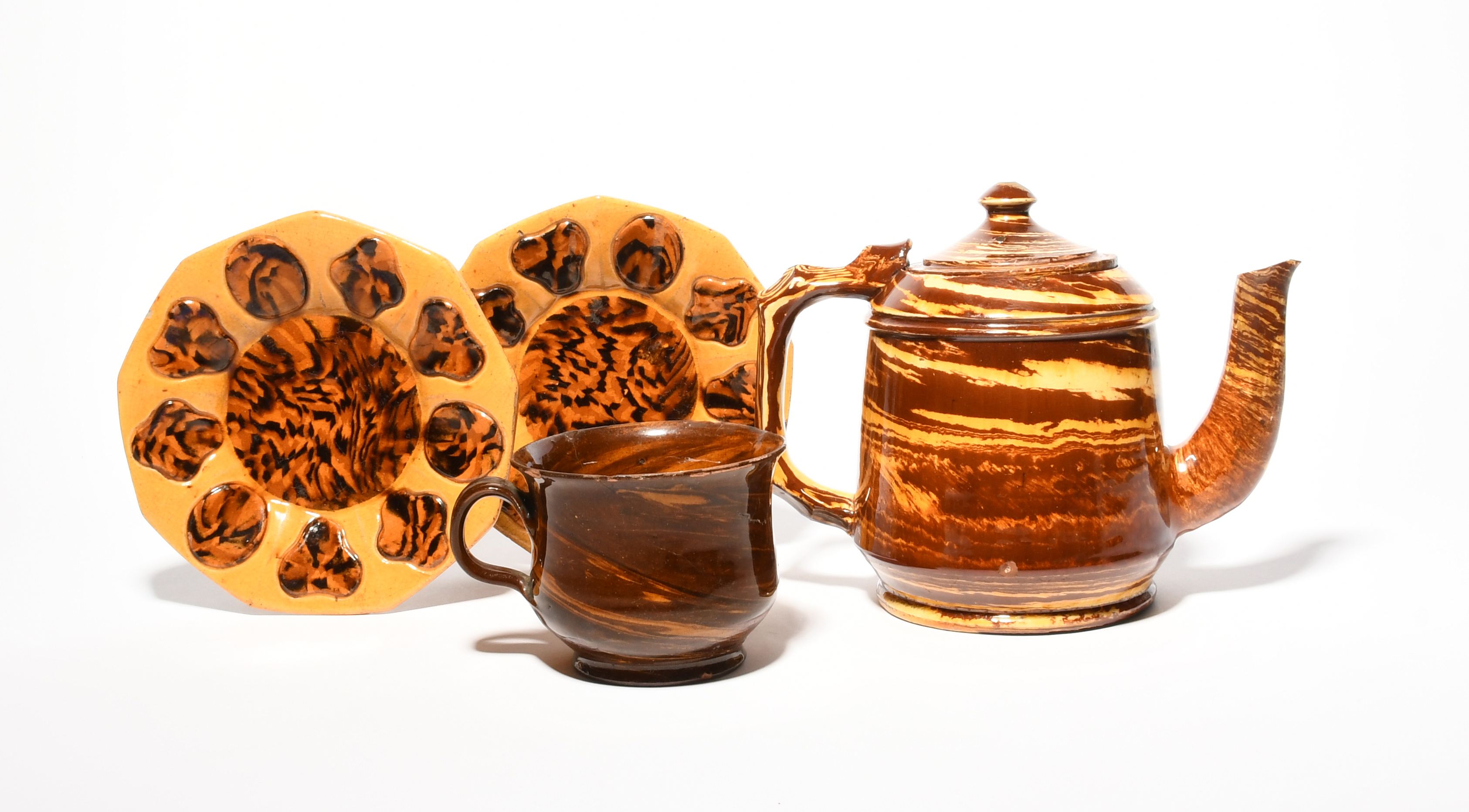 A Staffordshire slipware cup, late 18th century, modelled as agateware with cream and treacle - Image 2 of 2