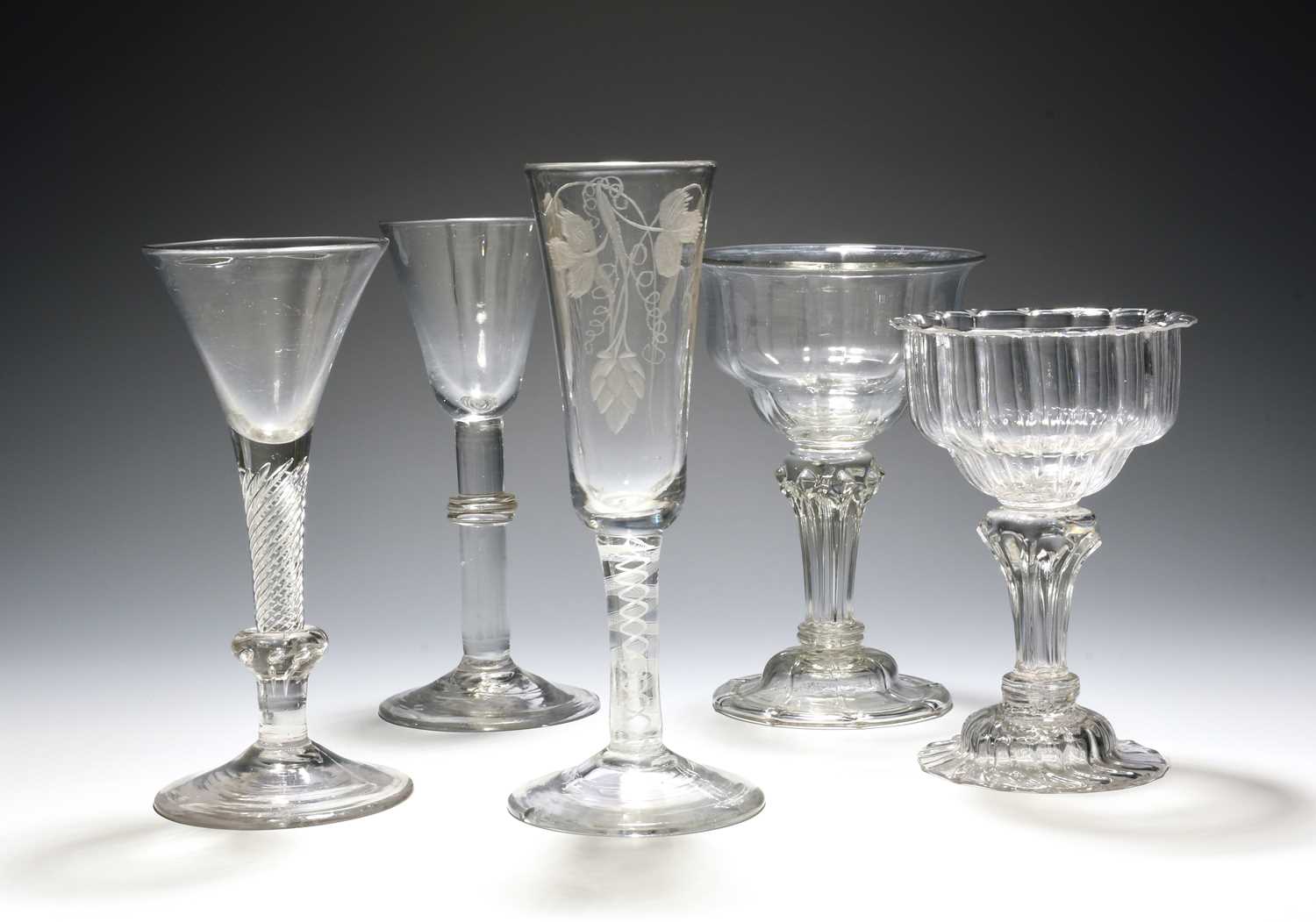 Five various English glasses, c.1740-60, including two sweetmeat glasses raised on pedestal stems