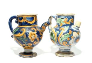 Two Caltagirone maiolica wet drug jars or ewers, 18th/19th century, typically decorated with