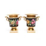 A pair of small two-handled vases, c.1820-30, painted with roses, tulips and other garden flowers in