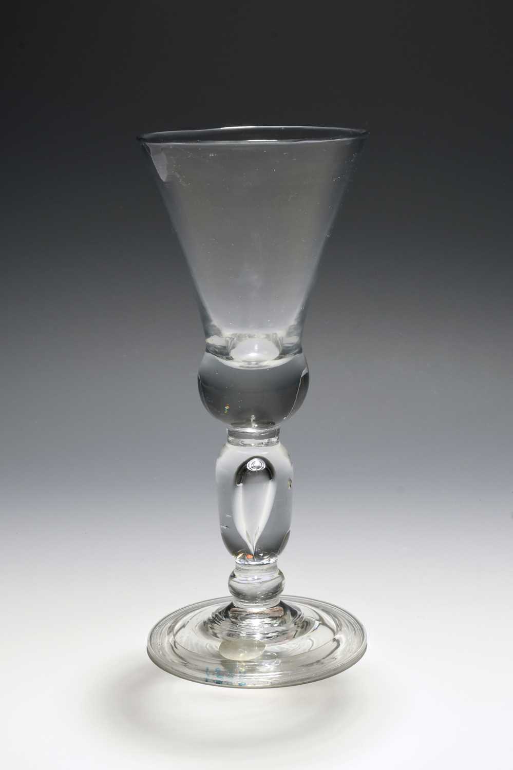 A large and rare baluster wine glass or goblet, c.1710, the thistle bowl with a solid base, raised - Image 2 of 2