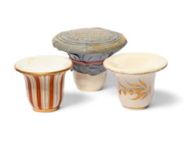 Two English porcelain rouge pots, c.1810-20, one decorated with vertical stripes in orange, white