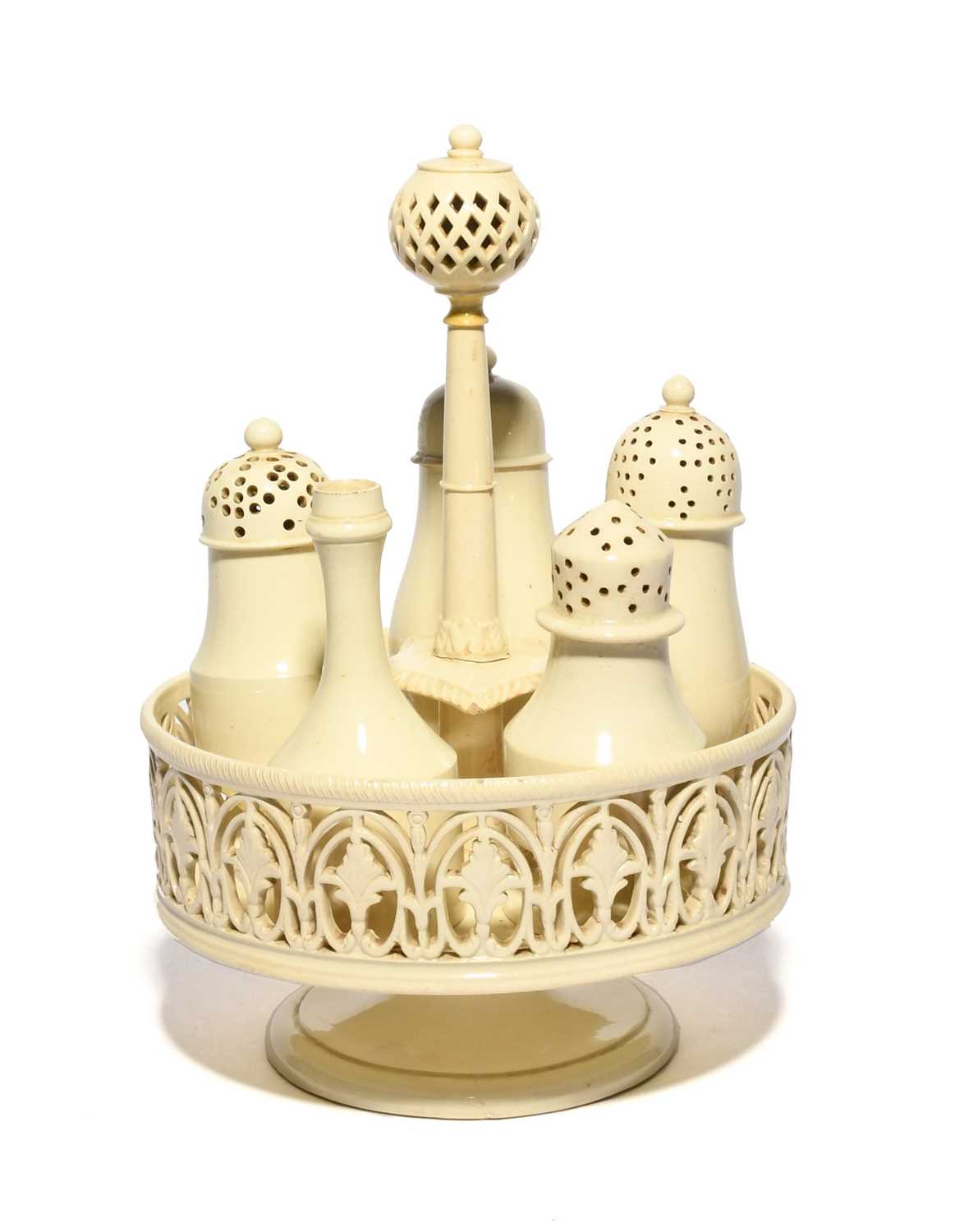 A Leeds creamware cruet or condiment stand, late 18th century, the circular galleried stand set with