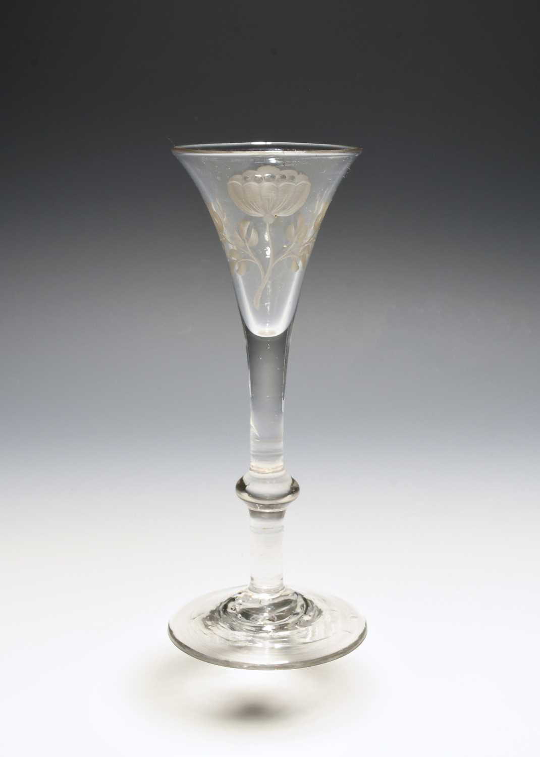 An unusual wine glass of possible Jacobite significance, c.1760, the drawn trumpet bowl engraved