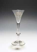 An unusual wine glass of possible Jacobite significance, c.1760, the drawn trumpet bowl engraved