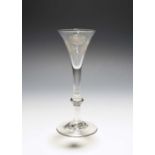 An unusual wine glass of possible Jacobite significance, c.1760, the drawn trumpet bowl engraved