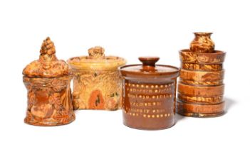 Four slipware jars and covers, 19th/early 20th century, a Sussex agateware pot pourri modelled