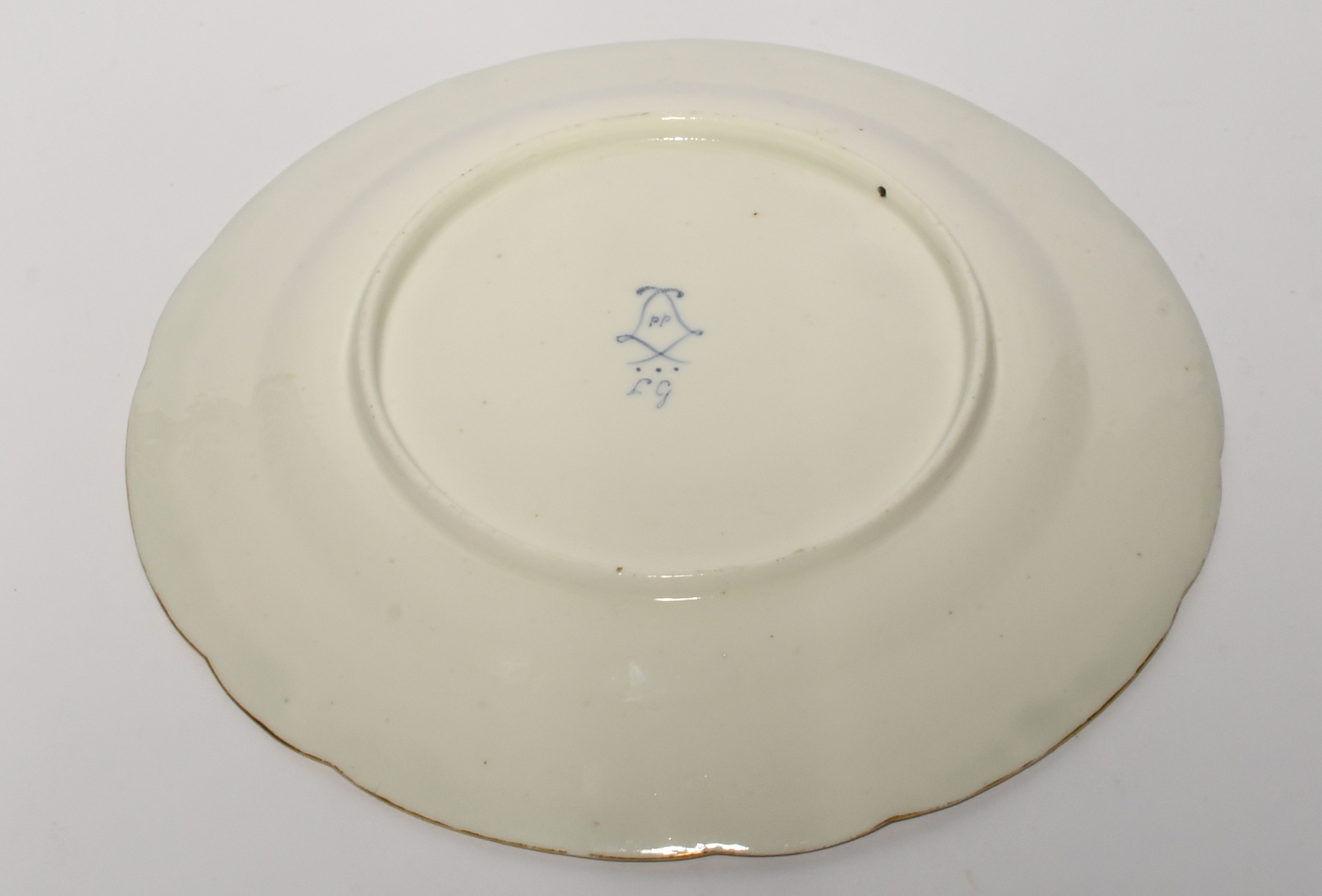 A Sèvres plate, the porcelain 18th century, probably later decorated with a central roundel of - Bild 2 aus 2