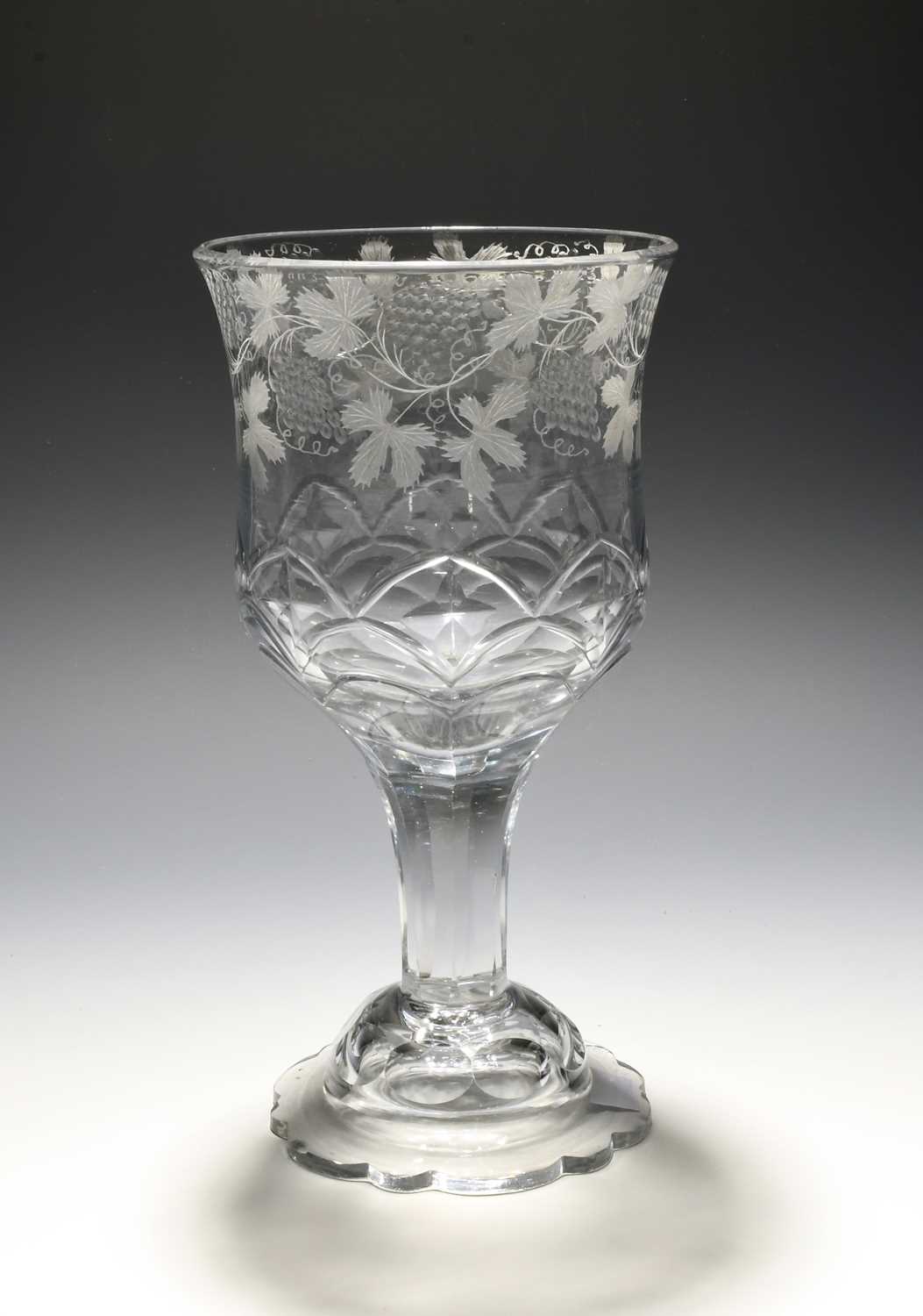 A large engraved glass goblet, c.1770-80, the slightly waisted bowl engraved with a continuous