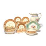 A Derby part tea service, c.1815, decorated with a formal gilt and polychrome foliate border on a