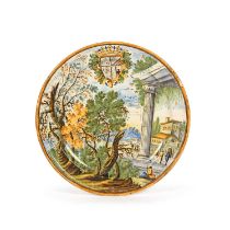 A Castelli maiolica armorial plate, 1st half 18th century, painted in typical palette of green,