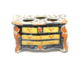 A Nevers faïence bough pot, 18th century, modelled as a chest of drawers and painted in yellow,