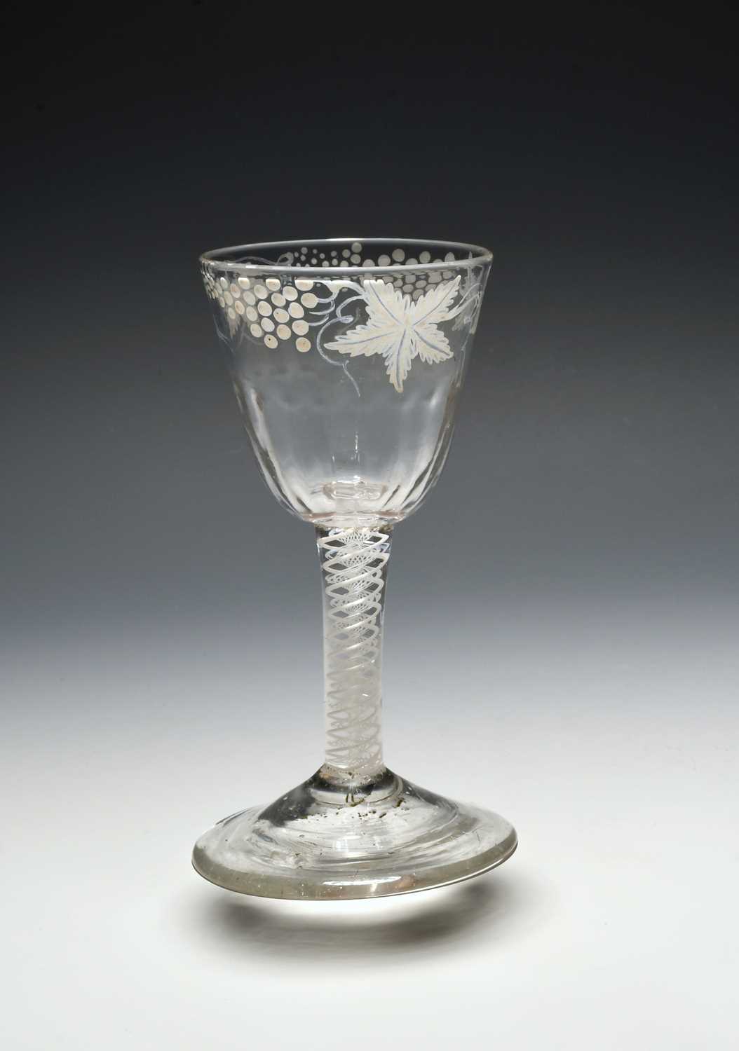 A small Beilby wine glass, c.1770, the round funnel bowl moulded to the base with vertical flutes,