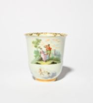 A Capodimonte cup, c.1750, the slender form painted with a Watteau-esque scene of a couple in a