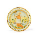 A small Italian maiolica dish or tazza, 18th century, painted with St Francis of Assisi kneeling and