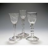 Three small wine glasses, c.1760, two of possible Jacobite significance, engraved with a bird and