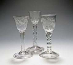 Three small wine glasses, c.1760, two of possible Jacobite significance, engraved with a bird and