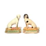 A pair of Wood type pearlware figures of dogs, c.1785-95, modelled as a spaniel and a pointer seated