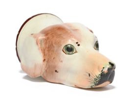 A pearlware stirrup cup, early 19th century, modelled as the head of a dog or hound, its coat