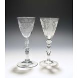 Two Dutch engraved baluster wine glasses, c.1750, one engraved with the Royal coat of arms over a