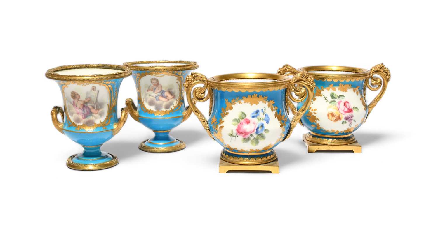 A pair of Sèvres ormolu-mounted small vases, 2nd half 18th century, painted with flower sprays
