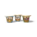 Three Paris porcelain rouge pots, c.1830, possibly Jacob Petit, one painted with a seated pastoral