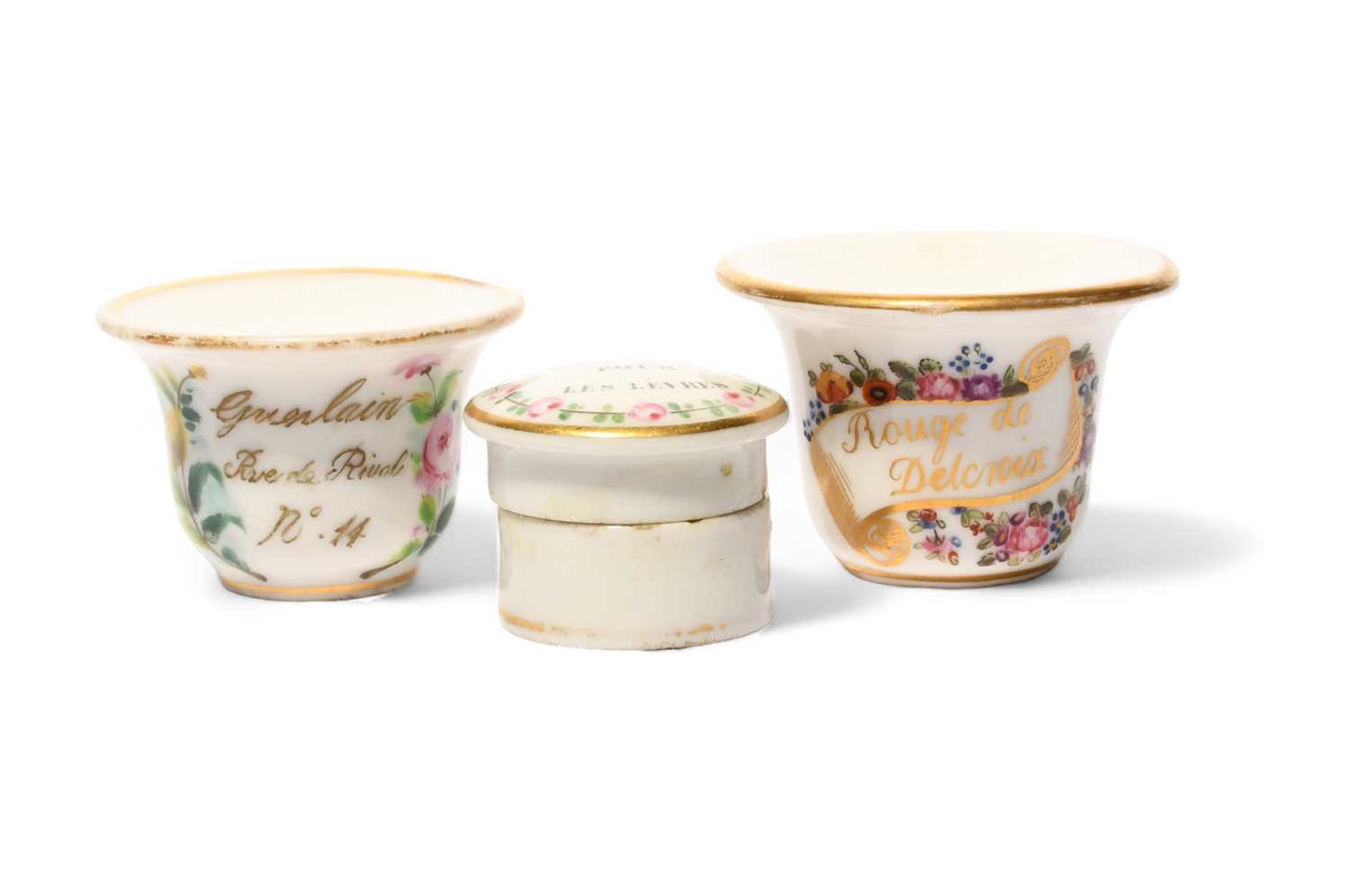 Two Paris porcelain rouge pots, c.1810-30, one inscribed 'Rouge de Delcroix' on a banner amidst