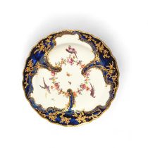 A Chelsea cabinet plate, c.1760-65, the well painted with three birds perched on a continuous flower